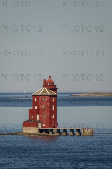 Kjeungskjær Fyr, red lighthouse, off the Norwegian coast on a small archipelago off Ørland, Trø¸ndelag.Uthaug, Trø¸ndelag, Norway, Scandinavia, Europe, adventure travel, monument protection, fjord, tourism, Hurtigruten, Hurtigruten voyage, island, cruise, coast, coastal landscape, lighthouse, NOR, travel, destination, skerry, sea voyage, seabird sanctuary, sightseeing, tourism, Trøndelag, tower, Uthaug, octagonal, Norwegian, red colour, red facade, Scandinavian, touristy, Red Lighthouse, wooden lighthouse, historic lighthouse, landmark, landmarking