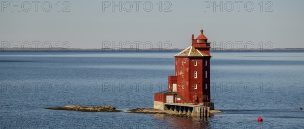 Kjeungskjær Fyr, red lighthouse, off the Norwegian coast on a small archipelago off Ã˜rland, Trø¸ndelag.Uthaug, Trø¸ndelag, Norway, Scandinavia, Europe, adventure travel, monument protection, fjord, tourism, Hurtigruten, Hurtigruten voyage, island, cruise, coast, coastal landscape, lighthouse, NOR, travel, destination, skerry, sea voyage, seabird sanctuary, sightseeing, tourism, Trøndelag, tower, Uthaug, octagonal, Norwegian, red colour, red facade, Scandinavian, touristy, Red Lighthouse, wooden lighthouse, historic lighthouse, landmark, landmarking
