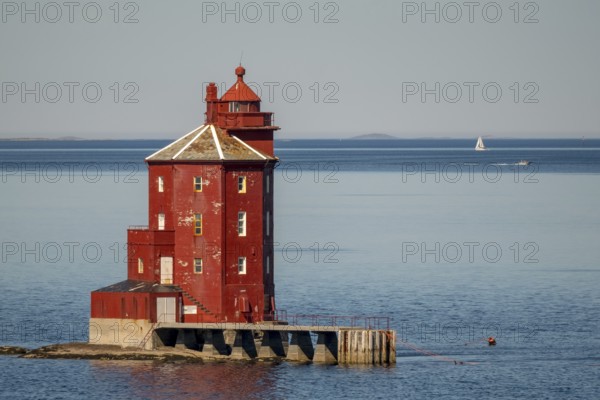 Kjeungskjær Fyr, red lighthouse, off the Norwegian coast on a small archipelago off Ã˜rland, Trø¸ndelag.Uthaug, Trø¸ndelag, Norway, Scandinavia, Europe, adventure travel, monument protection, fjord, tourism, Hurtigruten, Hurtigruten voyage, island, cruise, coast, coastal landscape, lighthouse, NOR, travel, destination, skerry, sea voyage, seabird sanctuary, sailing boat, sightseeing, tourism, Trøndelag, tower, Uthaug, octagonal, Norwegian, red colour, red facade, Scandinavian, tourist, Lroter Leutturm, wooden lighthouse, historic lighthouse, landmark, landmarking