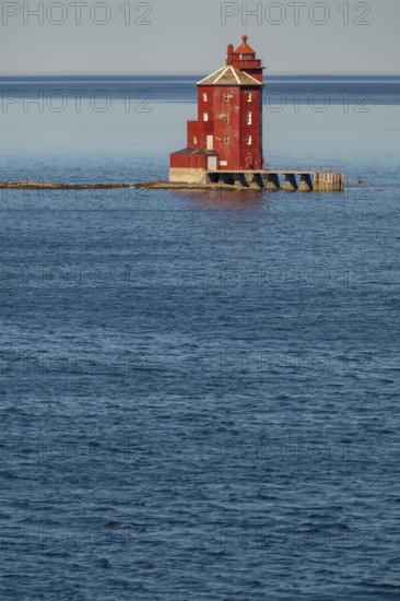 Kjeungskjær Fyr, red lighthouse, off the Norwegian coast on a small archipelago off Ã˜rland, Trø¸ndelag.Uthaug, Trø¸ndelag, Norway, Scandinavia, Europe, adventure travel, monument protection, fjord, tourism, Hurtigruten, Hurtigruten voyage, island, cruise, coast, coastal landscape, lighthouse, NOR, travel, destination, skerry, sea voyage, seabird sanctuary, sightseeing, tourism, Trøndelag, tower, Uthaug, octagonal, Norwegian, red colour, red facade, Scandinavian, touristy, Red Lighthouse, wooden lighthouse, historic lighthouse, landmark, landmarking
