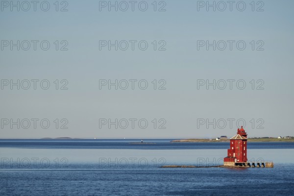 Kjeungskjær Fyr, red lighthouse, off the Norwegian coast on a small archipelago off Ã˜rland, Trø¸ndelag.Uthaug, Trø¸ndelag, Norway, Scandinavia, Europe, adventure travel, monument protection, fjord, tourism, Hurtigruten, Hurtigruten voyage, island, cruise, coast, coastal landscape, lighthouse, NOR, travel, destination, skerry, sea voyage, seabird sanctuary, sightseeing, tourism, Trøndelag, tower, Uthaug, octagonal, Norwegian, red colour, red facade, Scandinavian, touristy, Red Lighthouse, wooden lighthouse, historic lighthouse, landmark, landmarking