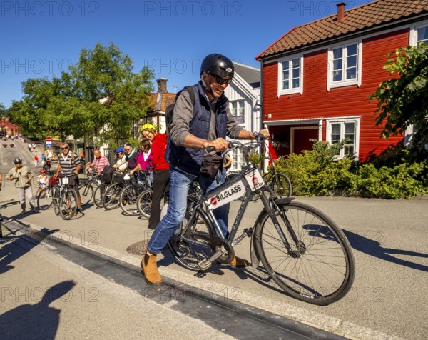 Tourist at bike rental, Trondheim, bike lift, Trøndelag, Norway, Scandinavia, Europe, adventure travel, bicycle, tourism, Hurtigruten, Hurtigruten trip, cruise, NOR, travel, destination, sea trip, sightseeing, Sykkelservice, tourism, Trøndelag, Norwegian, Scandinavian, touristic