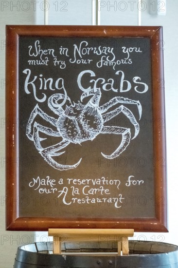 Dining plan, advertising poster for king crabs, Molde, Møre og Romsdal, Norway, Scandinavia, Europe, adventure travel, food and drink, tourism, inn, gastronomy, Hurtigruten, Hurtigruten voyage, crabs, cruise, Møre og Romsdal, NOR, travel, destination, reservation, restaurant, sea voyage, sightseeing, tourism, advertising, Norwegian, Scandinavian, touristic