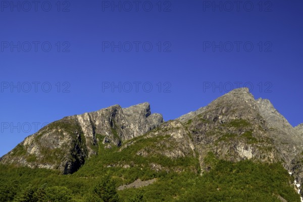 Trollstigen Camping, Innfjorden, Møre og Romsdal, Norway, Scandinavia, Europe, adventure travel, mountains, ridge, camping, camping site, campsite, cliffs, leisure, tourism, mountain, mountain range, mountain landscape, mountain range, Hurtigruten, Hurtigruten voyage, cruise, Møre og Romsdal, NOR, travel, destination, sea voyage, sightseeing, tourism, Norwegian, Scandinavian, tourist, mountain in the shape of an Indian