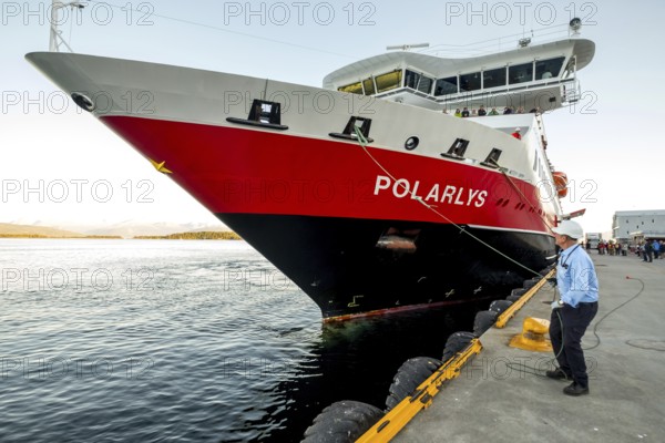 Sailor, sailor mooring the ship MS Polarlys at the quay, harbour bollard with mooring line, Molde harbour, Møre og Romsdal, Norway, Scandinavia, Europe, adventure travel, tourism, harbour, Hurtigruten, Hurtigruten voyage, cruise, cruise ship, Molde, Møre og Romsdal, NOR, shipping company Hurtigruten AS, journey, destination, ship, shipping, sea voyage, sightseeing, tourism, Norwegian, Scandinavian, touristic