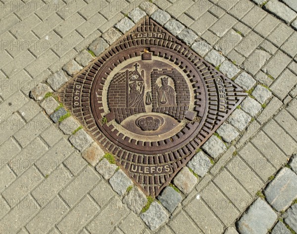 Canal cover Ulefos, coat of arms of Trondheim, Trondheim, Trøndelag, Norway, Scandinavia, Europe, 12th century, adventure travel, tourism, Hurtigruten, Hurtigruten voyage, canal cover, cruise, artwork, Middle Ages, NOR, travel, destination, sea voyage, sight, sightseeing, tourism, Trøndelag, coat of arms, historical, Norwegian, Scandinavian, touristic