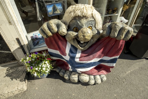 Troll figure with Norwegian flag, Trondheim, Trøndelag, Norway, Scandinavia, Europe, adventure travel, tourism, Hurtigruten, Hurtigruten voyage, cruise, NOR, journey, destination, sea voyage, sightseeing, tourism, Trøndelag, Norwegian, Scandinavian, touristic