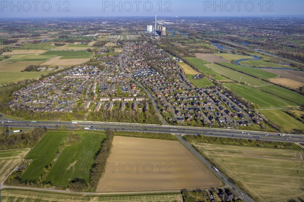Aerial view, residential area, Stockum district with view to the WE Generation SE power plant Gersteinwerk, Stockum, motorway A1 and on the right the nature reserve Lippeaue from Stockum to Werne, Werne, Ruhr area, North Rhine-Westphalia, Germany, DE, Europe, property tax, real estate, aerial view, aerial photography, aerial photography, Münsterland, overview, bird's eye view, residential area, living and life, residential area, residential quality, residential quarter, housing estate, residential area, birds-eyes view, overview