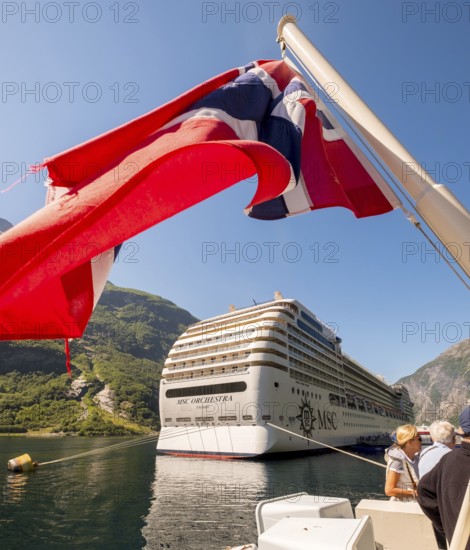Ship MSC Orchestra Panama, Norwegian flag, Geiranger, Møre og Romsdal, Norway, Scandinavia, Europe, adventure trip, balcony cabin, balconies, flags, tourism, Hurtigruten, Hurtigruten voyage, cruise, Møre og Romsdal, NOR, shipping company MSC Cruises, travel, destination, sea voyage, sightseeing, tourism, Norwegian, Scandinavian, touristic