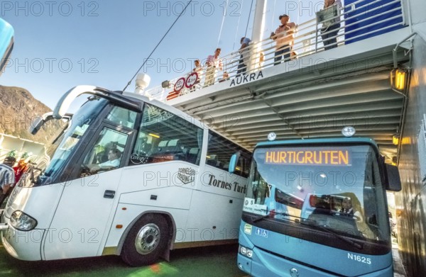 Coaches on a ferry, Eidsdal, Møre og Romsdal, Norway, Scandinavia, Europe, adventure travel, tourism, Hurtigruten, Hurtigruten trip, cruise, Møre og Romsdal, NOR, travel, coach, destination, sea trip, sightseeing, tourism, Norwegian, Scandinavian, touristic