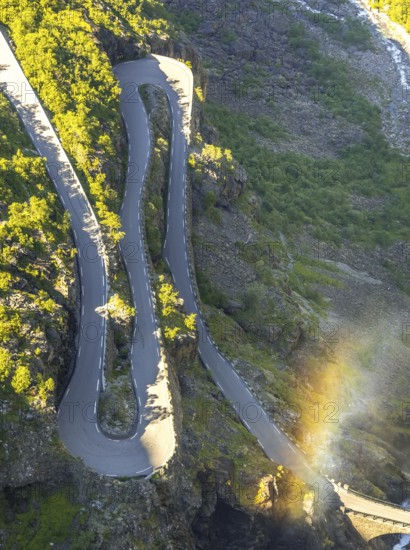 Trollstigen near Andalsnes, serpentines, hairpin bends, Stigfossen waterfall, Innfjorden, Møre og Romsdal, Norway, Scandinavia, Europe, adventure trip, mountain road R63, tourism, Hurtigruten, Hurtigruten trip, cruise, Møre og Romsdal, NOR, rainbow, travel, destination, sea trip, sightseeing, tourism, waterfall, Norwegian, Scandinavian, touristic
