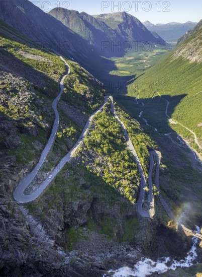 Trollstigen near Andalsnes, serpentines, hairpin bends, Stigfossen waterfall, Innfjorden, Møre og Romsdal, Norway, Scandinavia, Europe, adventure trip, mountain road R63, tourism, Hurtigruten, Hurtigruten trip, cruise, Møre og Romsdal, NOR, travel, destination, sea trip, sightseeing, tourism, waterfall, Norwegian, Scandinavian, touristic