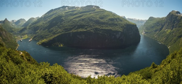 GeirangerFjord Loop, Geiranger town view, Queen Elisabeth and MSC Orchestra ship at anchor, Møre og Romsdal, Norway, Scandinavia, Europe, adventure trip, mountains and valleys, mountainside, mountain ridge, tourism, mountain range, mountain landscape, Geiranger, harbour, Hurtigruten, Hurtigruten voyage, hilly landscape, cruise, cruise ship, Møre og Romsdal, NOR, travel, destination, ship, sea voyage, sightseeing, tourism, UNESCO World Heritage Site, forest area, Norwegian, Scandinavian, touristic