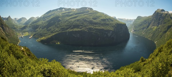 GeirangerFjord Loop, Geiranger town view, Queen Elisabeth and MSC Orchestra ship at anchor, Møre og Romsdal, Norway, Scandinavia, Europe, adventure trip, mountains and valleys, mountainside, mountain ridge, tourism, mountain range, mountain landscape, Geiranger, harbour, Hurtigruten, Hurtigruten voyage, hilly landscape, cruise, cruise ship, Møre og Romsdal, NOR, travel, destination, ship, sea voyage, sightseeing, tourism, UNESCO World Heritage Site, forest area, Norwegian, Scandinavian, touristic