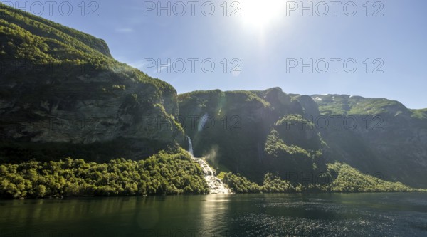 Seven Sisters Waterfall, Geirangerfjord, Geiranger, Møre og Romsdal, Norway, Scandinavia, Europe, adventure travel, mountains, mountainside, fjord, tourism, mountain, mountain range, mountain landscape, mountain range, Hurtigruten, Hurtigruten voyage, cruise, Møre og Romsdal, NOR, travel, destination, sea voyage, sightseeing, tourism, UNESCO World Heritage Site, forest area, waterfall, Norwegian, Scandinavian, tourist, waterfall