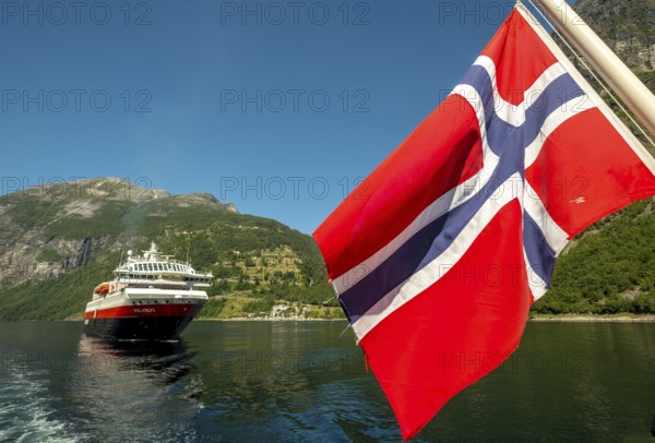Ship MS Polarlys, Norwegian flag, Geiranger, Møre og Romsdal, Norway, Scandinavia, Europe, adventure trip, flags, tourism, Hurtigruten, Hurtigruten trip, cruise, cruise ship, Møre og Romsdal, NOR, national flag, trip, destination, ship, shipping, sea trip, sightseeing, tourism, Norwegian, Scandinavian, touristic