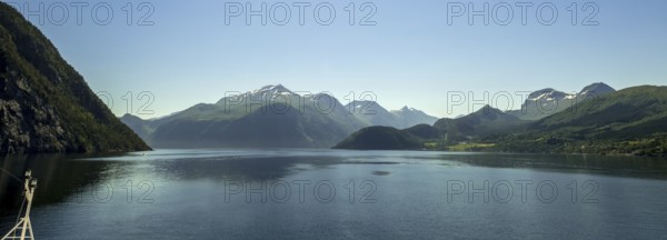 Panoramic view, fjord and mountain formations, Storfjord, Stranda, Møre og Romsdal, Norway, Scandinavia, Europe, adventure trip, mountains, fjord, tourism, Hurtigruten, Hurtigruten trip, cruise, Møre og Romsdal, NOR, nature, panoramic view, panoramic photo, travel, destination, ship bow, sea trip, sightseeing, tourism, blue sea, Norwegian, Scandinavian, touristic