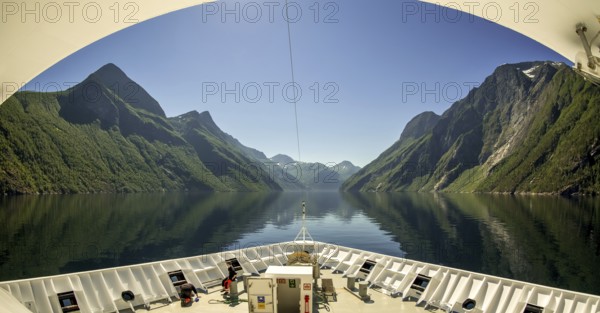 Panoramic view, bow, Storfjord, tranda, Møre og Romsdal, Norway, Scandinavia, Europe, adventure trip, view, mountains, mountainside, Eidsdal, fjord, tourism, mountain, mountain range, mountain landscape, mountain range, Hurtigruten, Hurtigruten voyage, cruise, Møre og Romsdal, NOR, panoramic view, panoramic photo, journey, destination, ship's bow, sea voyage, sightseeing, Stranda, tourism, blue sea, Norwegian, Scandinavian, touristic