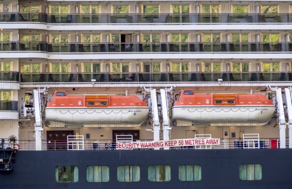 Ship RMS Queen Elizabeth, warning to sea pirates, security warning keep 50 metres away, lifeboats, Geiranger, Møre og Romsdal, Norway, Scandinavia, Europe, adventure travel, mountainside, tourism, Hurtigruten, Hurtigruten voyage, cabin window, cruise, cruise ship, Møre og Romsdal, NOR, passenger ship, shipping company Hurtigruten AS, travel, destination, Royal Mail Ship, ship, sea voyage, sightseeing, tourism, Norwegian, Scandinavian, touristic