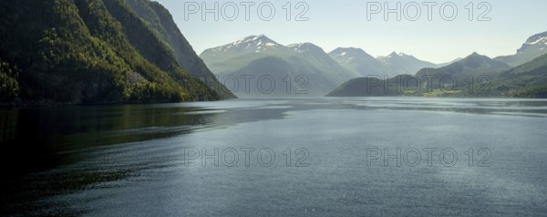Panoramic view, fjord and mountain formations, Storfjord, Stranda, Møre og Romsdal, Norway, Scandinavia, Europe, adventure travel, mountains, fjord, tourism, Hurtigruten, Hurtigruten voyage, cruise, Møre og Romsdal, NOR, panoramic view, panoramic photo, travel, destination, ship's bow, sea voyage, sightseeing, tourism, blue sea, Norwegian, Scandinavian, touristic