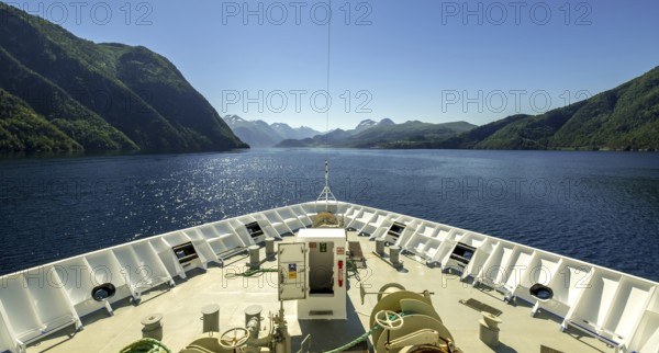 Panoramic view, bow, Storfjord, Stranda, Møre og Romsdal, Norway, Scandinavia, Europe, adventure trip, view, mountains, mountainside, fjord, tourism, mountain, mountain range, mountain landscape, mountain range, Hurtigruten, Hurtigruten voyage, cruise, Møre og Romsdal, NOR, panoramic view, panoramic photo, journey, destination, ship's bow, sea voyage, sightseeing, tourism, blue sea, Norwegian, Scandinavian, touristic
