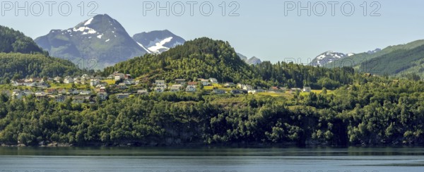 Panoramic view, fjord and mountain formations, Storfjord, Stranda town view, Møre og Romsdal, Norway, Scandinavia, Europe, adventure travel, mountains, fjord, tourism, property tax, Hurtigruten, Hurtigruten voyage, real estate, cruise, Møre og Romsdal, NOR, panoramic view, panoramic photo, travel, destination, ship's bow, sea voyage, sightseeing, Stranda, tourism, residential complex, living and life, residential area, residential houses, residential quality, residential neighbourhood, housing estate, blue sea, Norwegian, Scandinavian, touristic