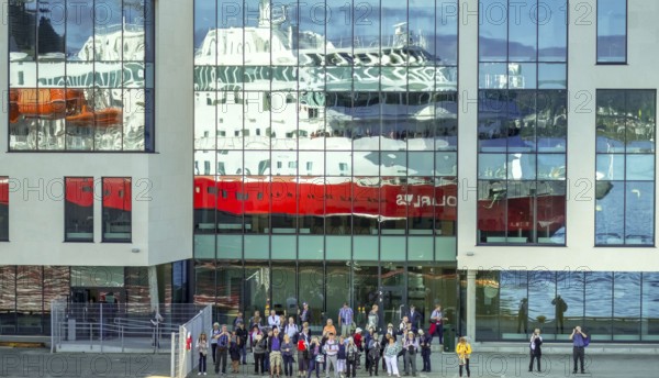 Cruise ship MS Polarlys, reflection, tourists at the quay, Ã...lesund, Møre og Romsdal, Norway, Scandinavia, Europe, adventure trip, excursion, excursion ship, tourism, harbour, Hurtigruten, Hurtigruten trip, cruise, cruise ship, Møre og Romsdal, NOR, journey, destination, ship, shipping, sea voyage, sightseeing, tourism, Norwegian, Scandinavian, touristic, Ålesund
