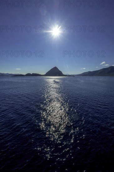 Backlight, island near Godøya, Møre og Romsdal, Norway, Scandinavia, Europe, adventure travel, mountain formation, tourism, Godøya, Hurtigruten, Hurtigruten voyage, cruise, Møre og Romsdal, NOR, travel, destination, sea voyage, sightseeing, sun, star shape, tourism, blue sea, Norwegian, Scandinavian, tourist, northland voyage, northern sea, ship passage