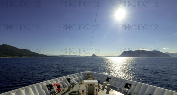 Ship bow, backlight, Godøya, Møre og Romsdal, Norway, Scandinavia, Europe, adventure travel, tourism, Godøya, Hurtigruten, Hurtigrutenreise, cruise, Møre og Romsdal, NOR, travel, destination, sea voyage, sightseeing, sun, star shape, tourism, blue sea, Norwegian, Scandinavian, touristic, nordlandreise, northern sea, ship passage
