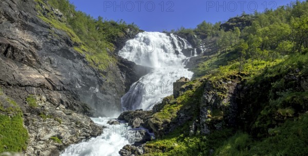 Kjosfossen waterfall, waterfall near Fureberget, rock faces, trees, sky, Flåm, Sogn og Fjordane, Norway, Scandinavia, Europe, Flåm, NOR, travel, tourism, destination, sightseeing, sea voyage, Hurtigruten, Hurtigruten trip, tourism, Norwegian, Scandinavian, tourist, cruise, adventure trip, waterfall, mountains, Flam Railway, Flamsbana, train journey, tour, travelling on the Flam Railway, Flam Railway