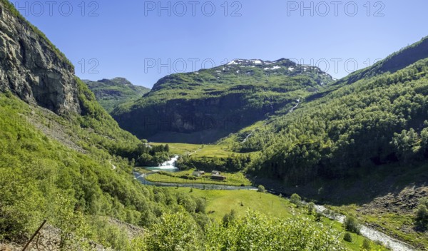Journey on the Flam Railway, iron railway journey, view from the Flåmsbana, Ryavegen, mountains, forests, meadows, blue sky, Flåm, Sogn og Fjordane, Norway, Scandinavia, Europe, Flåm, NOR, travel, tourism, destination, sightseeing, sea voyage, Hurtigruten, Hurtigruten voyage, tourism, Norwegian, Scandinavian, tourist, cruise, adventure trip