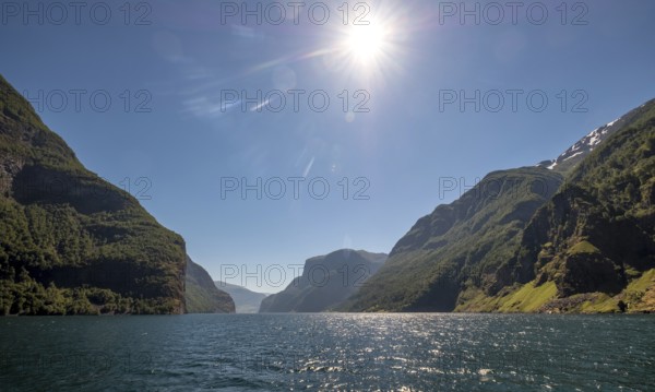 Fjord, Nærøyfjorden, Flåm, Gudvangen, mountains, trees, blue sky, sunshine, Undredal, Sogn og Fjordane, Norway, Scandinavia, Europe, NOR, travel, tourism, destination, sightseeing, sea voyage, Hurtigruten, Hurtigruten trip, tourism, Norwegian, Scandinavian, tourist, cruise, adventure trip, waters, water, sightseeing, hills, forests
