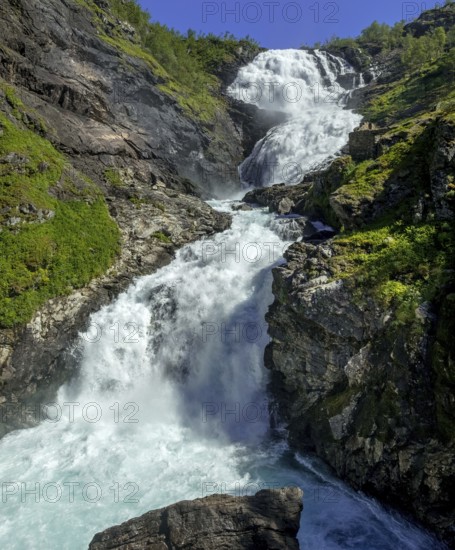 Kjosfossen waterfall, waterfall near Fureberget, rock faces, trees, sky, Flåm, Sogn og Fjordane, Norway, Scandinavia, Europe, Flåm, NOR, travel, tourism, destination, sightseeing, sea voyage, Hurtigruten, Hurtigruten trip, tourism, Norwegian, Scandinavian, tourist, cruise, adventure trip, waterfall, mountains, Flam Railway, Flamsbana, train journey, tour, travelling on the Flam Railway, Flam Railway