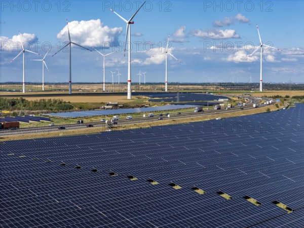 86, 5 MW peak ground-mounted photovoltaic systems, from RWE, with over 141, 000 solar modules, on a verge, over 1 km long, along the A44 motorway near Bedburg, at the Jackerath junction, recultivated open-cast mining site, wind farm north of Titz, North Rhine-Westphalia, Germany