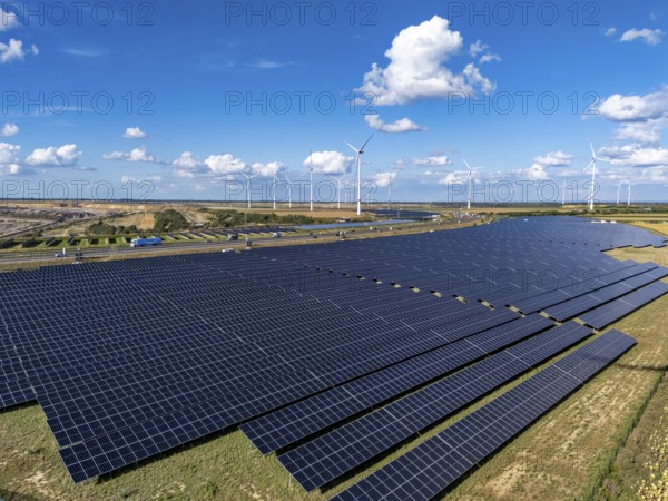 86, 5 MW peak ground-mounted photovoltaic systems, from RWE, with over 141, 000 solar modules, on a verge, over 1 km long, along the A44 motorway near Bedburg, at the Jackerath junction, recultivated open-cast mining site, wind farm north of Titz, North Rhine-Westphalia, Germany