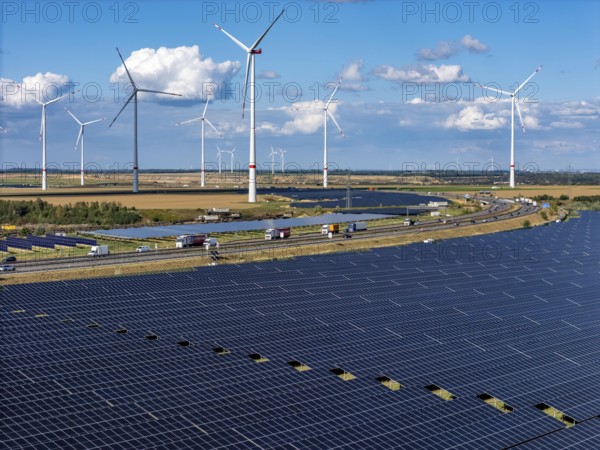86, 5 MW peak ground-mounted photovoltaic systems, from RWE, with over 141, 000 solar modules, on a verge, over 1 km long, along the A44 motorway near Bedburg, at the Jackerath junction, recultivated open-cast mining site, wind farm north of Titz, North Rhine-Westphalia, Germany