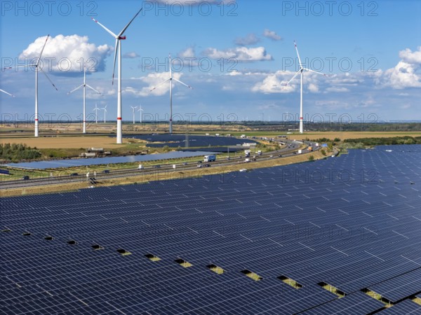 86, 5 MW peak ground-mounted photovoltaic systems, from RWE, with over 141, 000 solar modules, on a verge, over 1 km long, along the A44 motorway near Bedburg, at the Jackerath junction, recultivated open-cast mining site, wind farm north of Titz, North Rhine-Westphalia, Germany