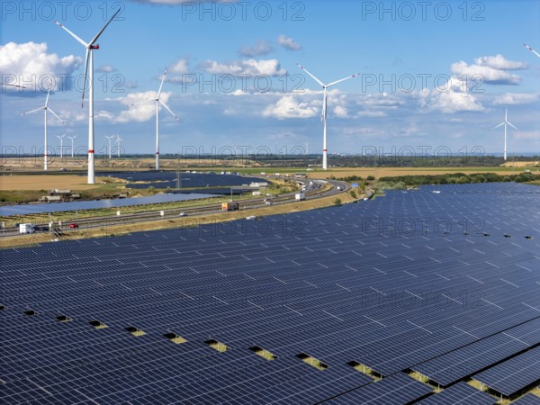 86, 5 MW peak ground-mounted photovoltaic systems, from RWE, with over 141, 000 solar modules, on a verge, over 1 km long, along the A44 motorway near Bedburg, at the Jackerath junction, recultivated open-cast mining site, wind farm north of Titz, North Rhine-Westphalia, Germany