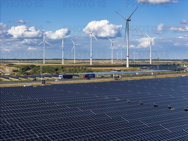 86, 5 MW peak ground-mounted photovoltaic systems, from RWE, with over 141, 000 solar modules, on a verge, over 1 km long, along the A44 motorway near Bedburg, at the Jackerath junction, recultivated open-cast mining site, wind farm north of Titz, North Rhine-Westphalia, Germany