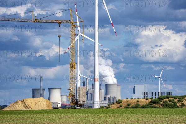 Construction site for the expansion of the wind farm east of Jackerath, in the Rhenish lignite mining area, in the background, the RWE lignite-fired power plant Neurath, North Rhine-Westphalia, Germany