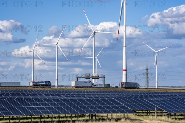 86, 5 MW peak ground-mounted photovoltaic systems, from RWE, with over 141, 000 solar modules, on a verge, over 1 km long, along the A44 motorway near Bedburg, at the Jackerath junction, recultivated open-cast mining site, wind farm north of Titz, North Rhine-Westphalia, Germany