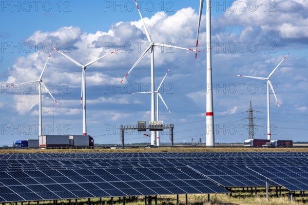 86, 5 MW peak ground-mounted photovoltaic systems, from RWE, with over 141, 000 solar modules, on a verge, over 1 km long, along the A44 motorway near Bedburg, at the Jackerath junction, recultivated open-cast mining site, wind farm north of Titz, North Rhine-Westphalia, Germany