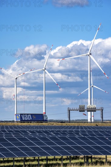 86, 5 MW peak ground-mounted photovoltaic systems, from RWE, with over 141, 000 solar modules, on a verge, over 1 km long, along the A44 motorway near Bedburg, at the Jackerath junction, recultivated open-cast mining site, wind farm north of Titz, North Rhine-Westphalia, Germany