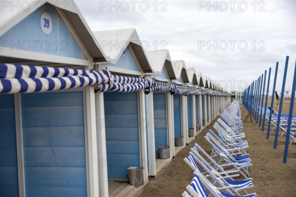 Venice, Italy - 2 September 2025: Beach chairs and cabins on the Lido beach during the 82nd Venice International Film Festival