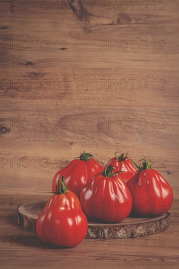 Khinkali tomatoes, on a wooden cutting board, wooden background, no people