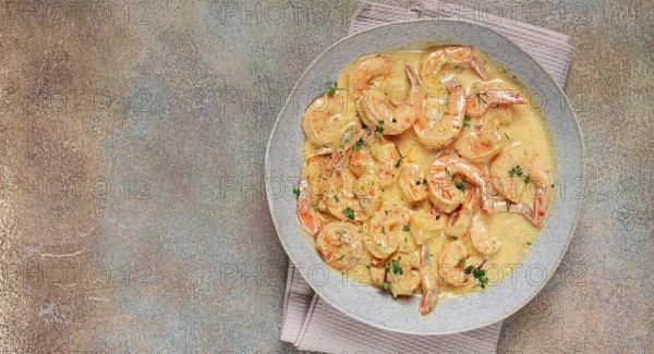 Shrimp in creamy garlic sauce, with spices and herbs