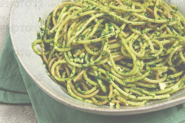 Spaghetti with pesto sauce, homemade, no people