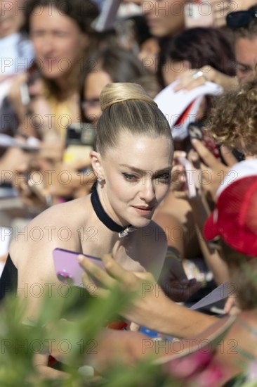 Venice, Italy - 1 September 2025: Amanda Seyfried signing autographs during the Red Carpet of - The Testament of Ann Lee - during the 82nd Venice International Film Festival