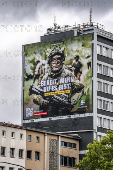 Large-format advertising poster of the German Armed Forces, for recruitment, on a residential building in Essen, on Viehofer Platz, North Rhine-Westphalia, Germany