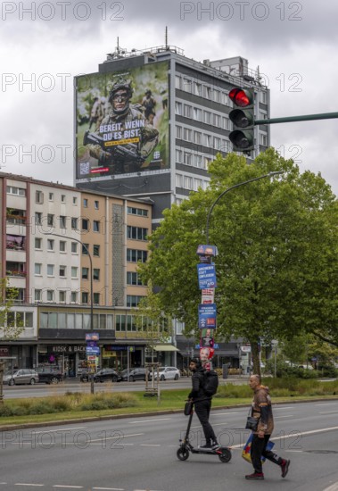 Large-format advertising poster of the German Armed Forces, for recruitment, on a residential building in Essen, on Viehofer Platz, North Rhine-Westphalia, Germany